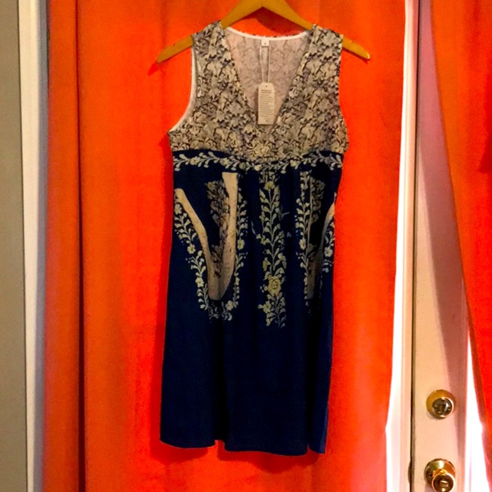 Sleeveless dress with rich blue and gold colors
